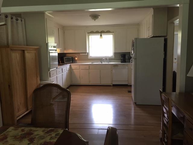 1219 Franklin Road Brentwood, TN 37027 - Photo 24 of 25 a kitchen with a refrigerator and a stove top oven