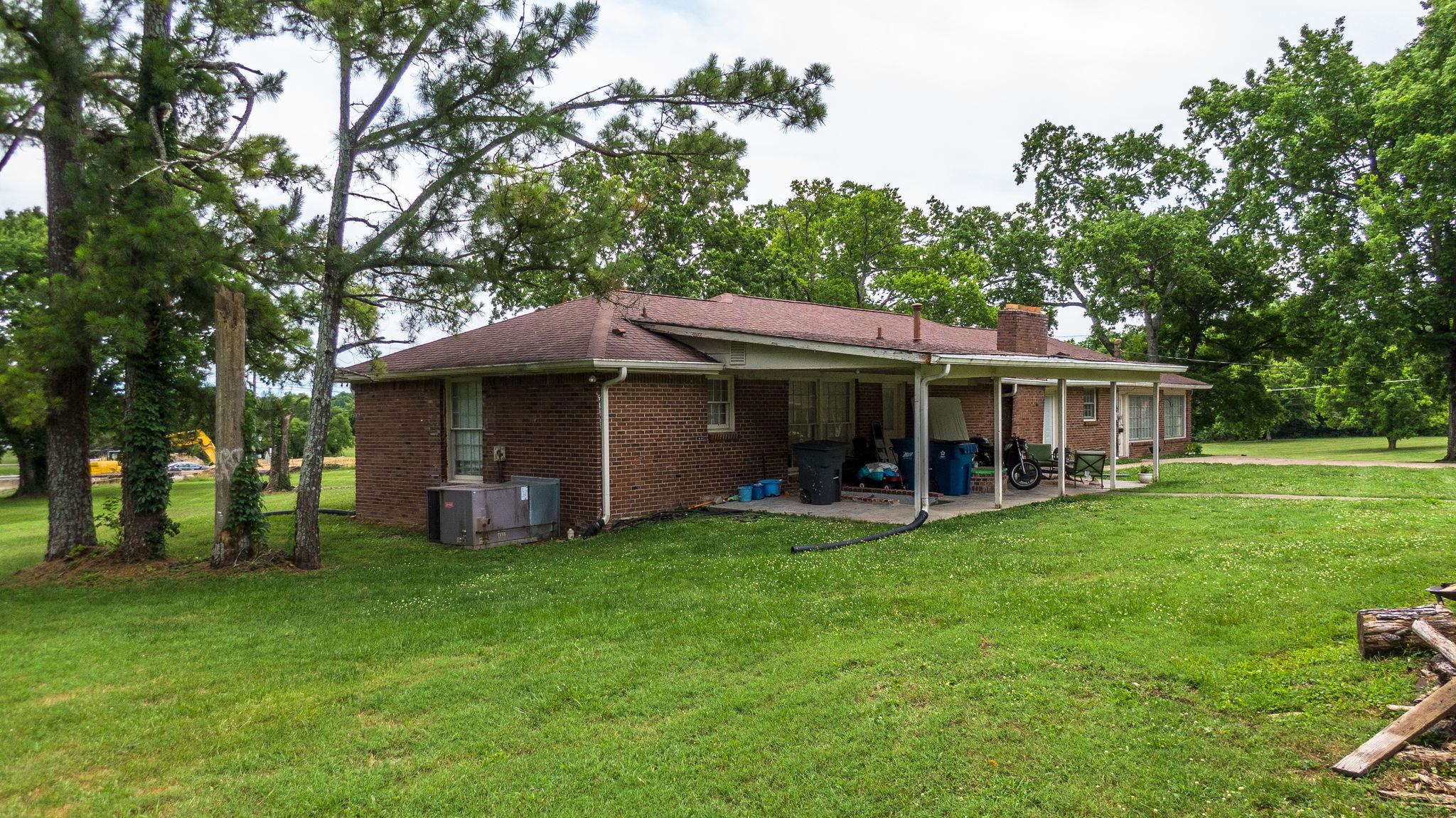 1219 Franklin Road Brentwood, TN 37027 - Photo 5 of 25 a view of a house with a yard and sitting area