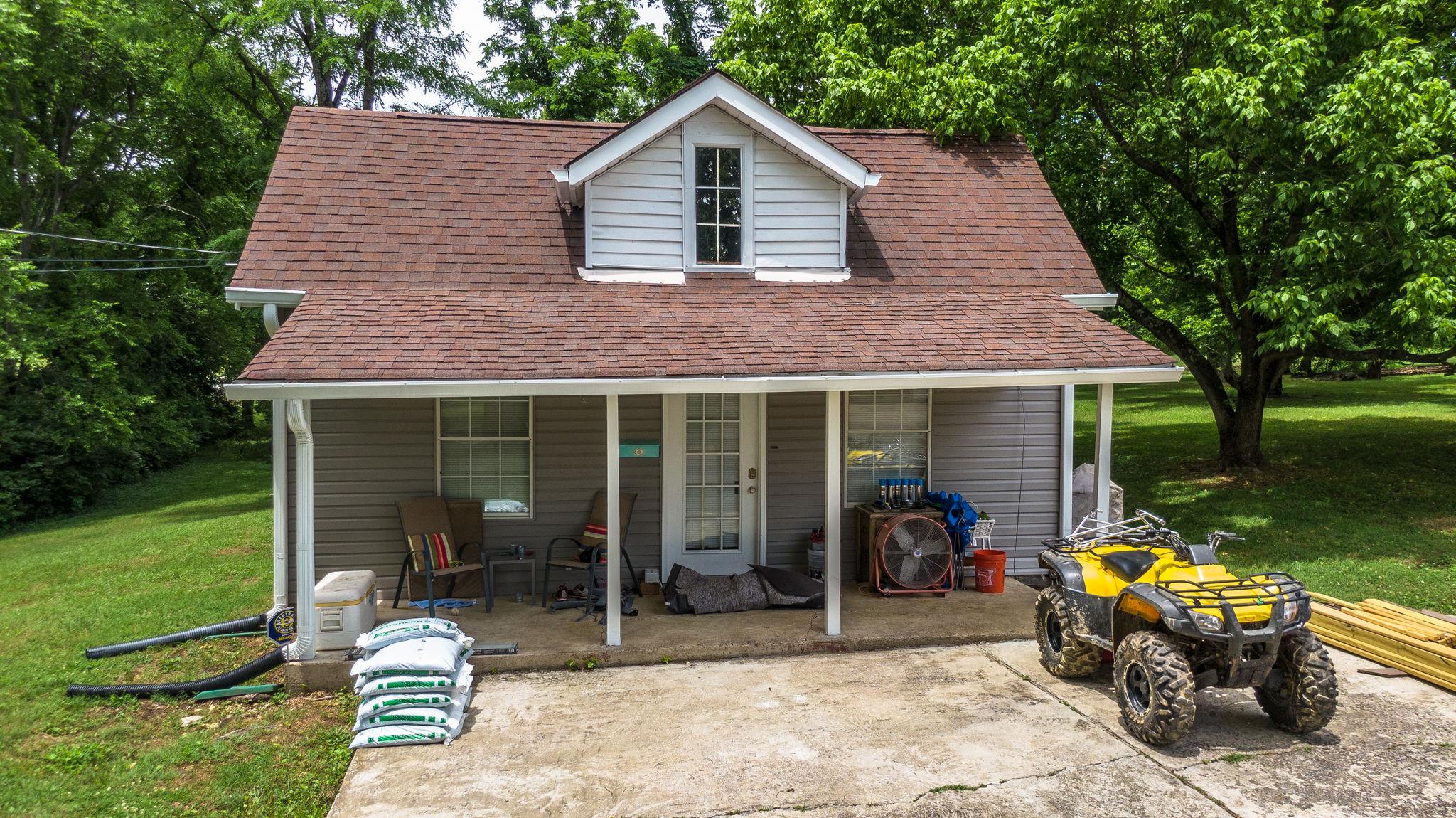 1219 Franklin Road Brentwood, TN 37027 - Photo 7 of 25 a front view of a house with patio