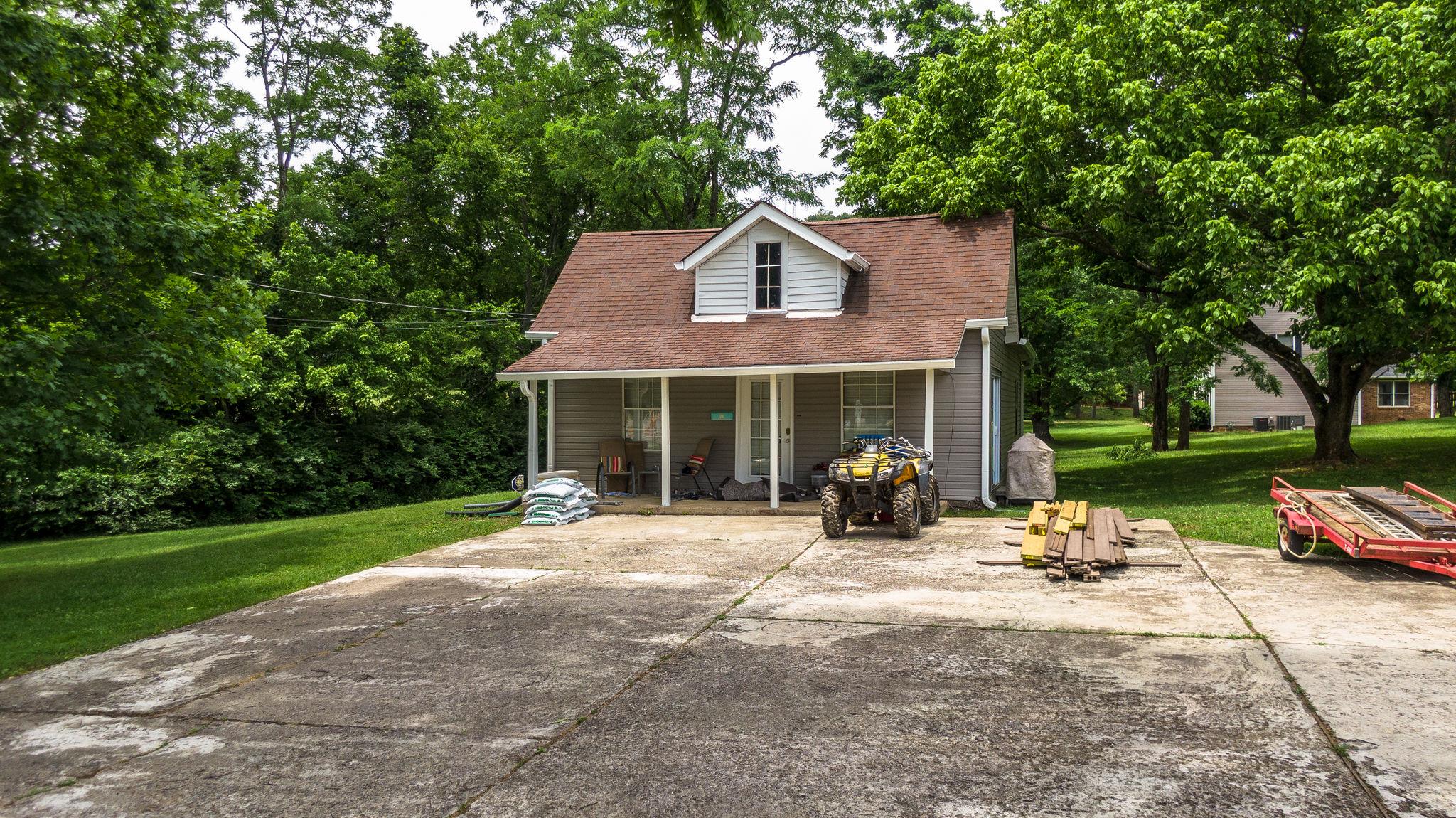 1219 Franklin Road Brentwood, TN 37027 - Photo 8 of 25 a view of a house with backyard porch and sitting area