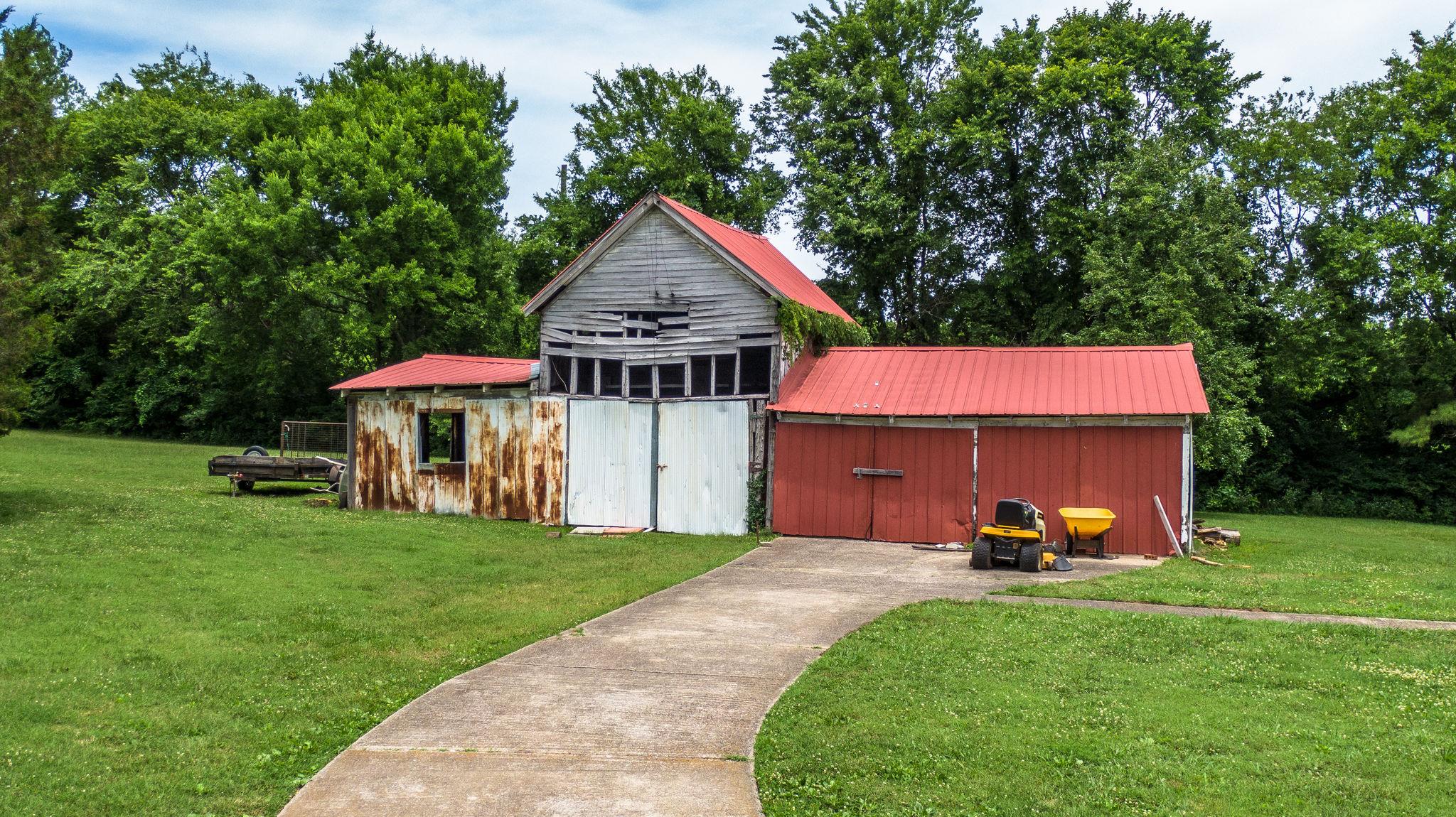 1219 Franklin Road Brentwood, TN 37027 - Photo 9 of 25 a front view of a house with garden