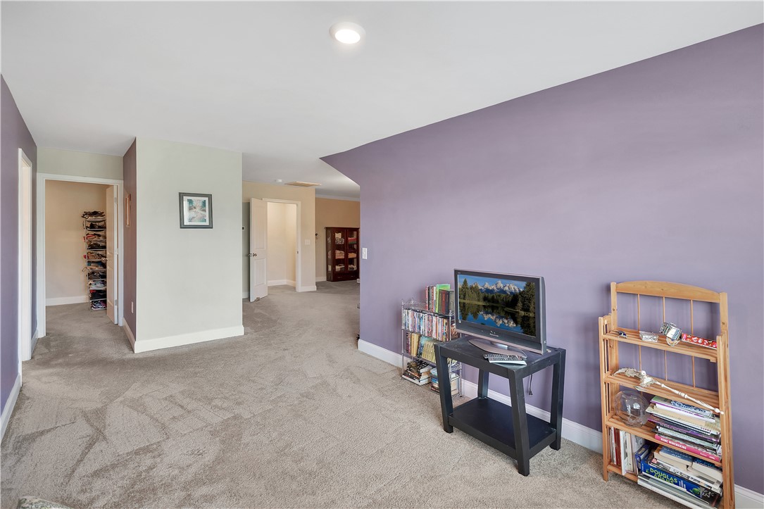 121 Ventura Street Anderson, SC 29621 - Photo 15 of 32 A versatile open-concept space featuring comfortable carpeting and ample room for various uses.