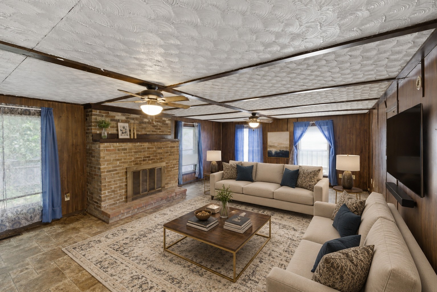 207 Center Street Portland, TN 37148 - Photo 3 of 26 a living room with furniture a flat screen tv and a fireplace