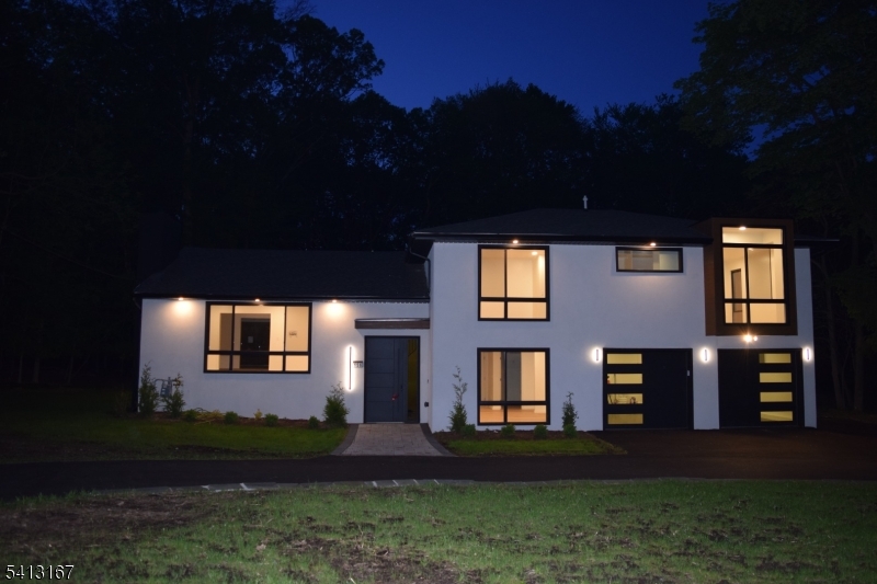 156 Park Road Parsippany, NJ 07054 - Photo 3 of 44 a front view of a house with a yard