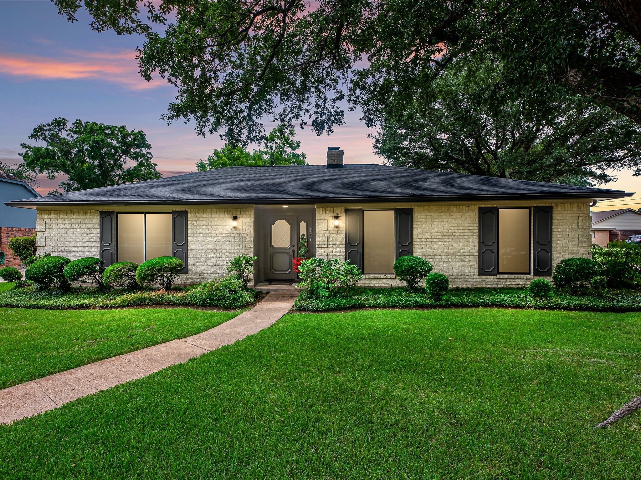 4002 Cujanes Street Pasadena, TX 77504 - Photo 1 of 26 a front view of a house with a yard