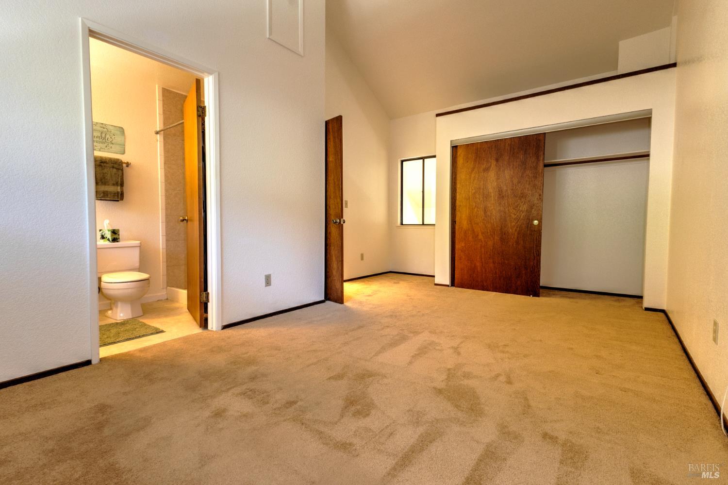 539 Norlee Street Sebastopol, CA 95472 - Photo 15 of 26 Master bedroom features it's own full bath, large closet, and interior "overlook" window to the downstairs livingroom.