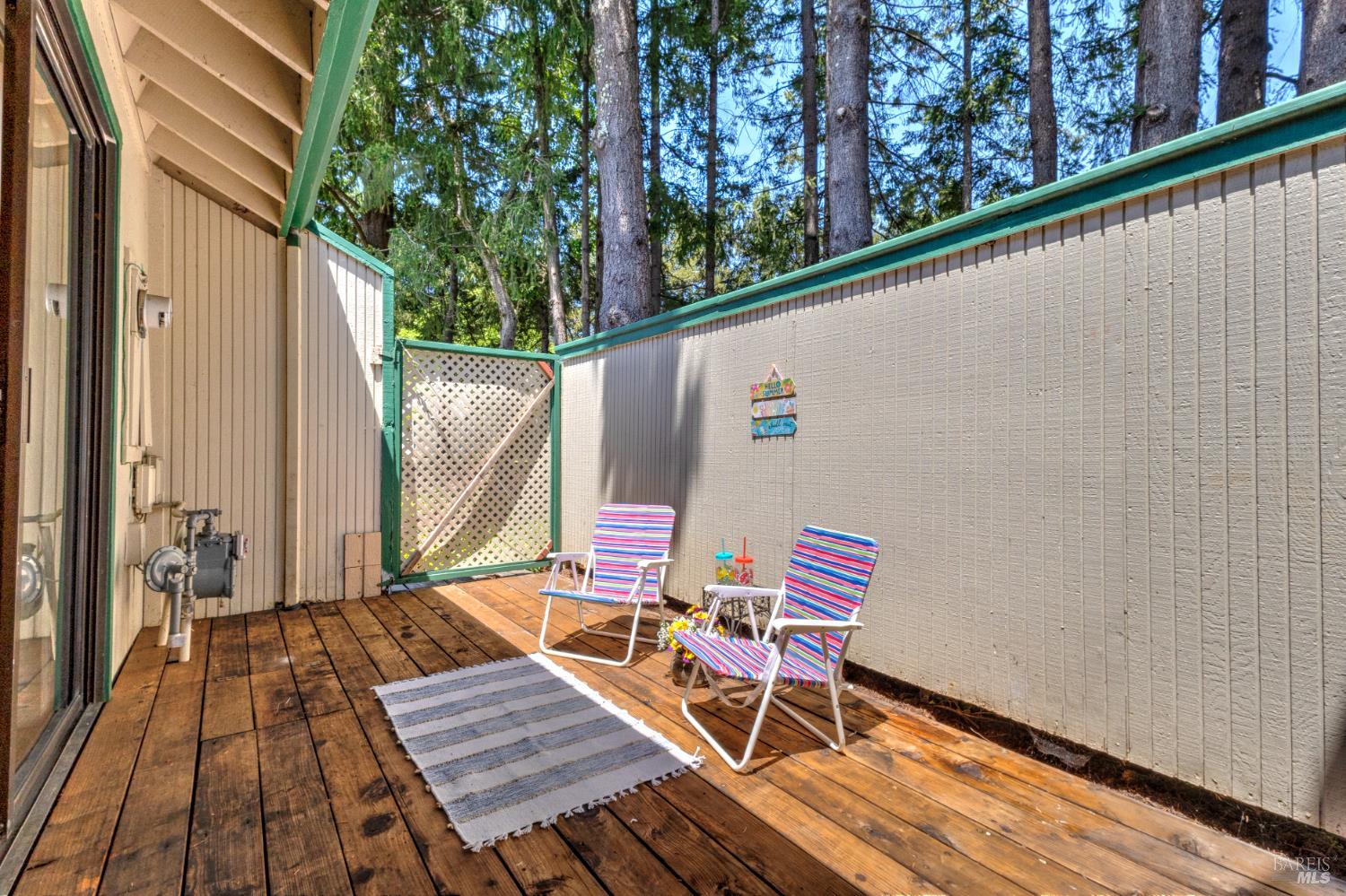 539 Norlee Street Sebastopol, CA 95472 - Photo 19 of 26 Back patio with wood decking and gate to wooded common area