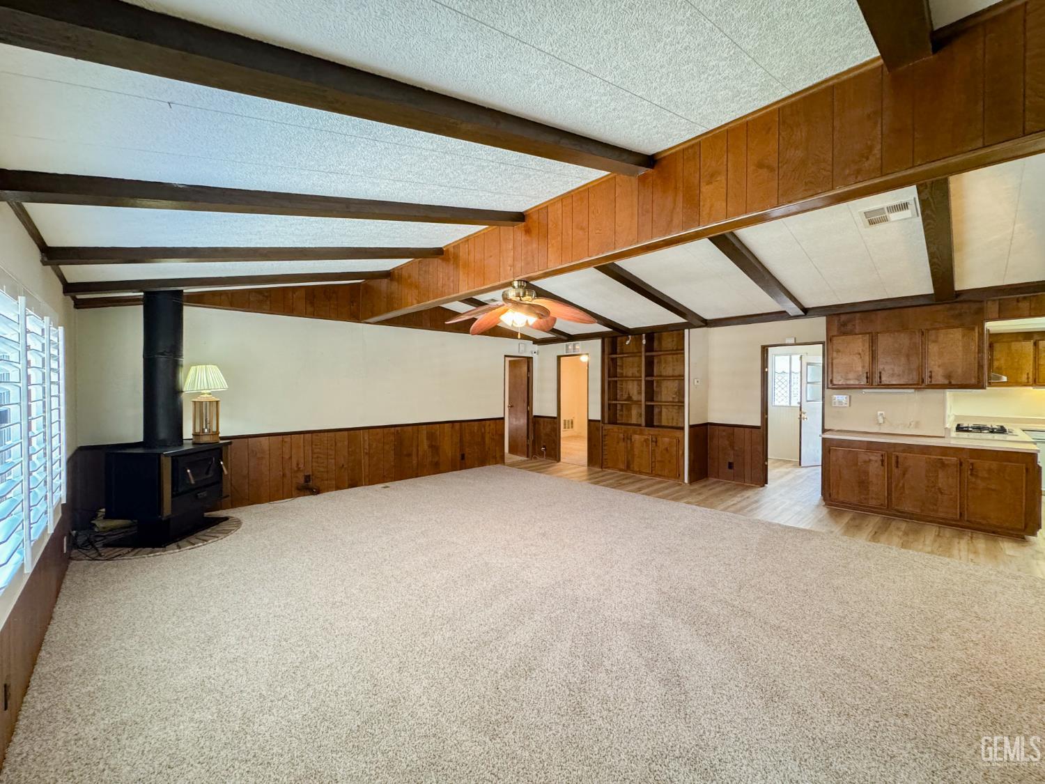Undisclosed Address Bakersfield, CA 93306 - Photo 19 of 41 a view of an empty room with a fireplace