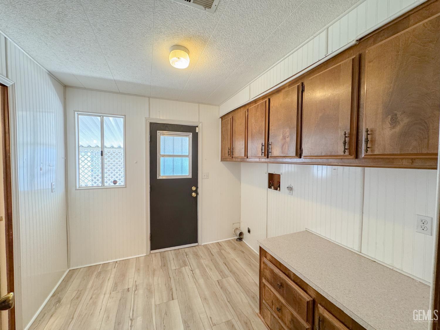 Undisclosed Address Bakersfield, CA 93306 - Photo 21 of 41 a kitchen with a refrigerator and countertop