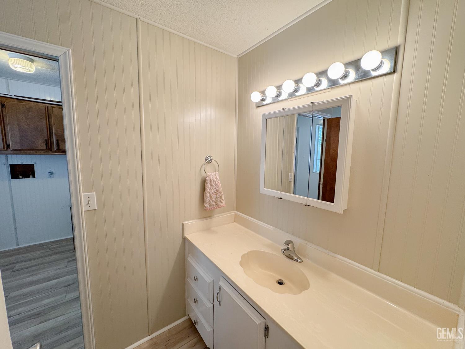 Undisclosed Address Bakersfield, CA 93306 - Photo 25 of 41 a bathroom with a double vanity sink and a mirror