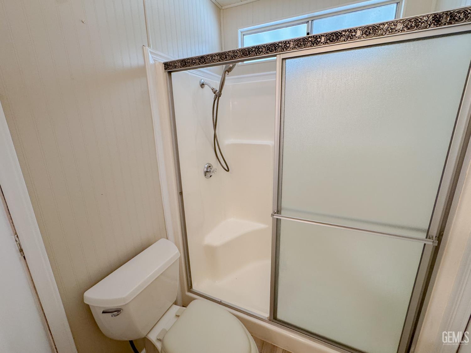 Undisclosed Address Bakersfield, CA 93306 - Photo 26 of 41 a bathroom with a shower and toilet