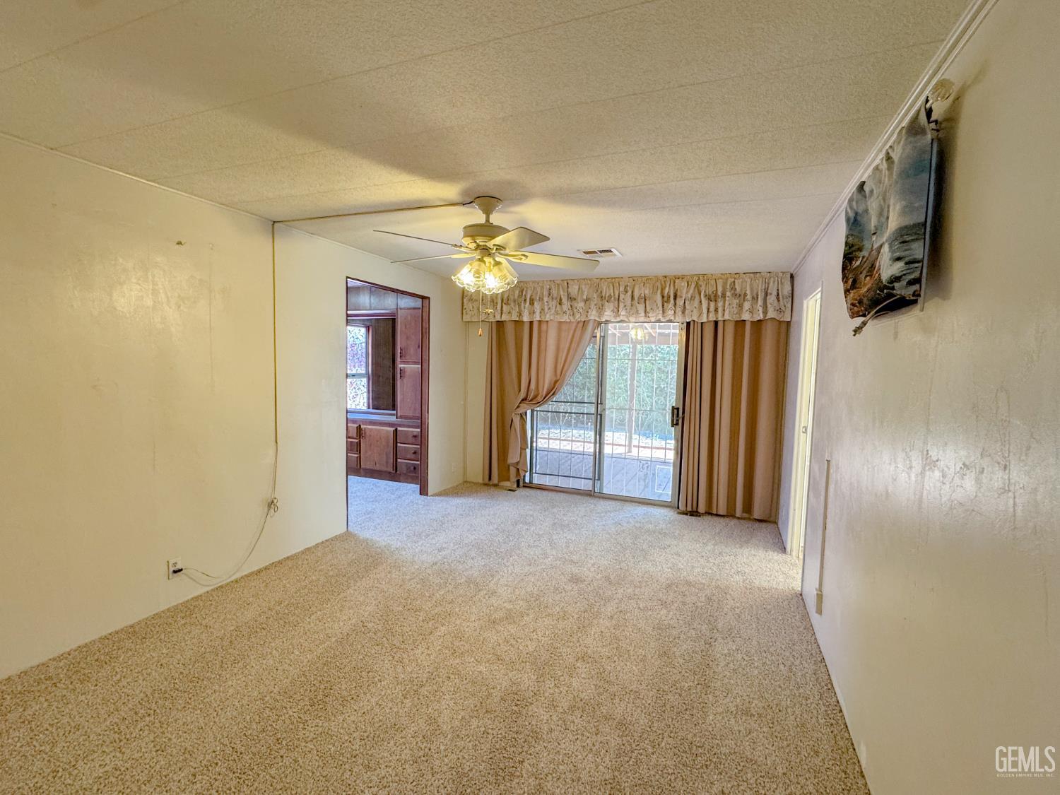 Undisclosed Address Bakersfield, CA 93306 - Photo 27 of 41 an empty room with windows and entryway