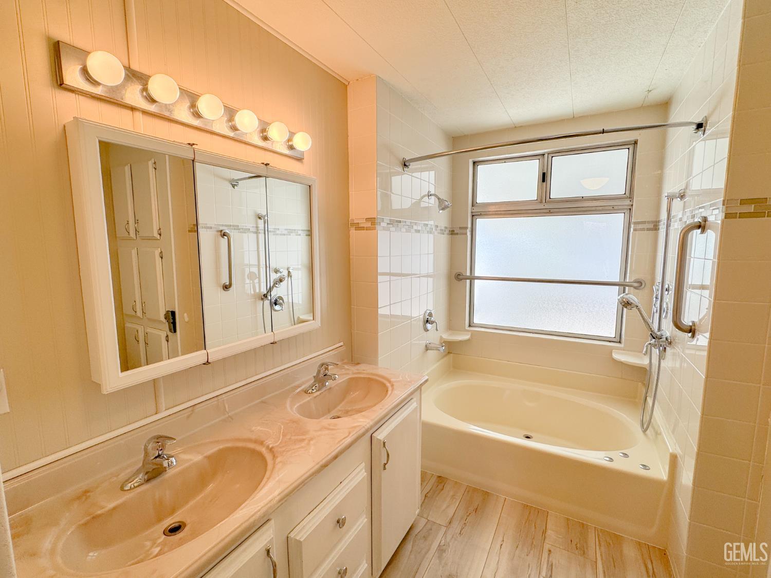 Undisclosed Address Bakersfield, CA 93306 - Photo 30 of 41 a bathroom with a tub sink and mirror