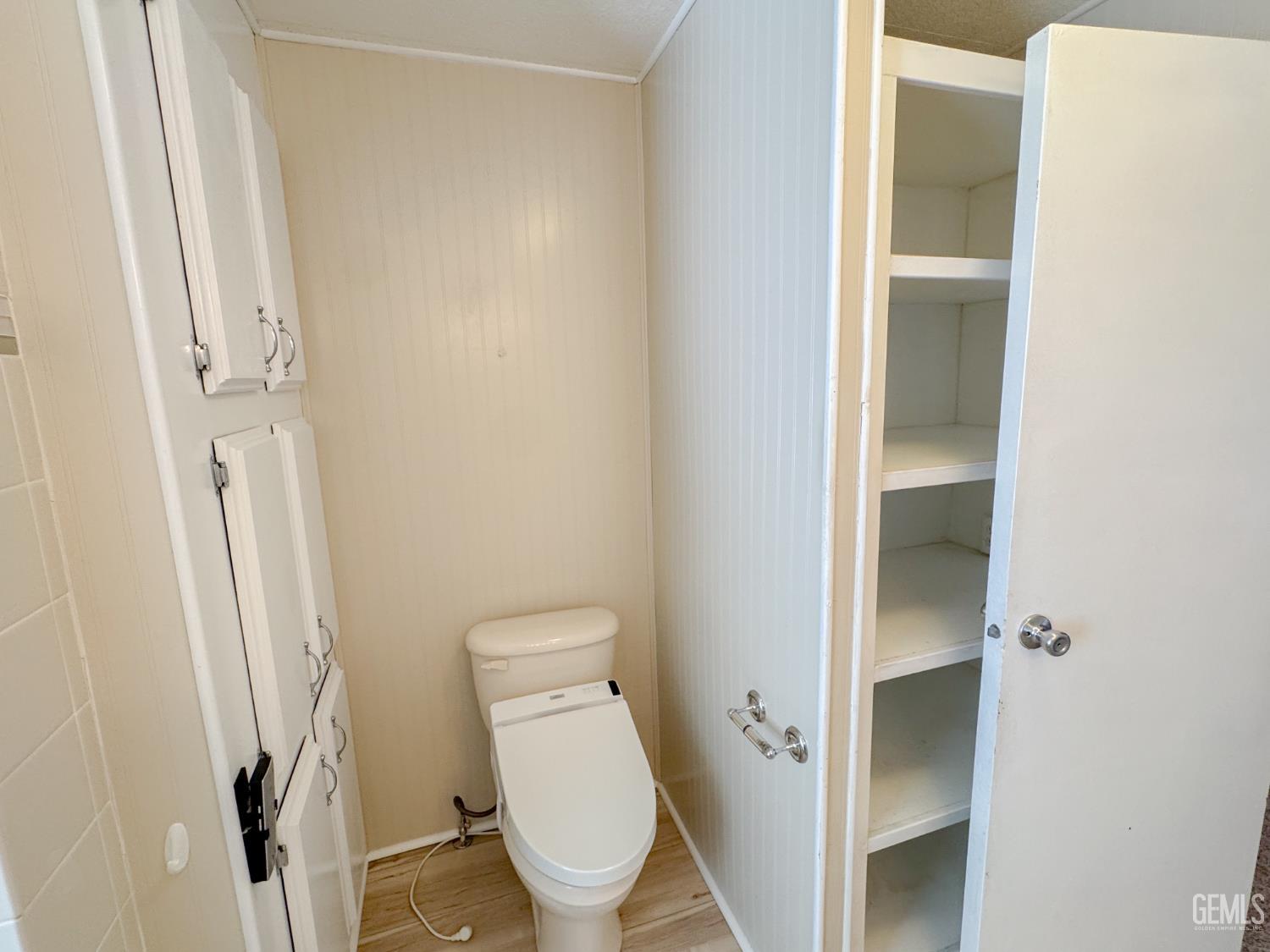 Undisclosed Address Bakersfield, CA 93306 - Photo 31 of 41 a white toilet sitting next to a shower