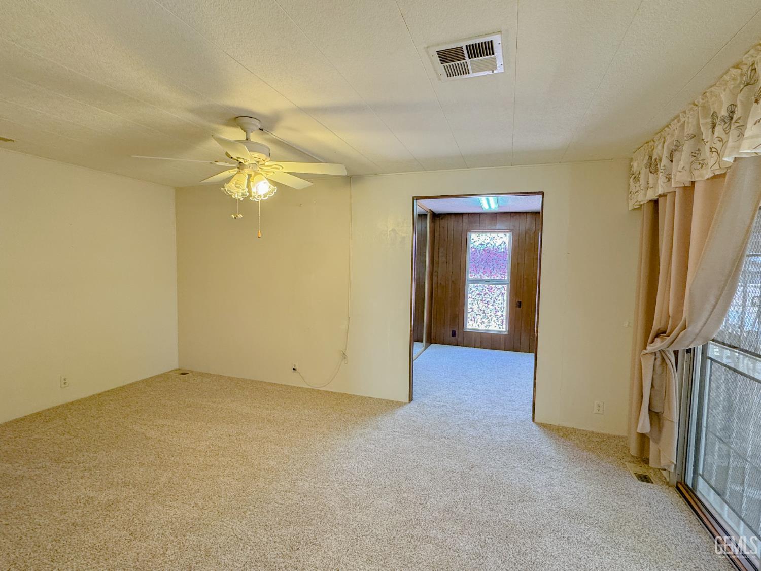 Undisclosed Address Bakersfield, CA 93306 - Photo 32 of 41 wooden floor in an empty room with a window