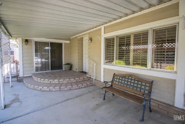 a outdoor space with a couch and large window