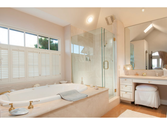 26156 Ladera Drive Carmel, CA 93923 - Photo 11 of 22 a bathroom with a tub sink and mirror