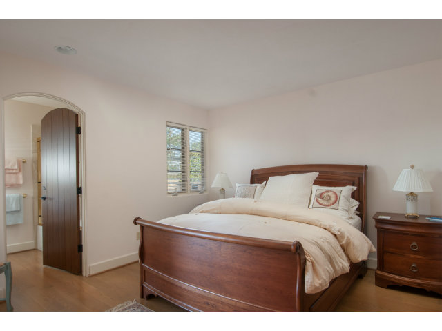 26156 Ladera Drive Carmel, CA 93923 - Photo 12 of 22 a bedroom with a bed and a dresser