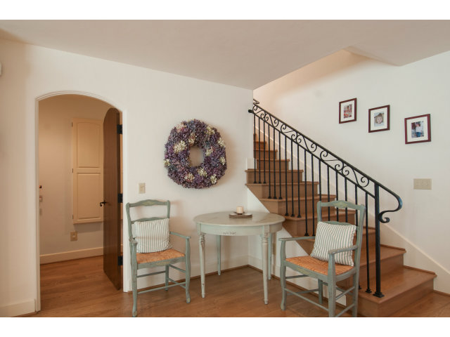 26156 Ladera Drive Carmel, CA 93923 - Photo 13 of 22 a view of a hallway with wooden floor and stairs