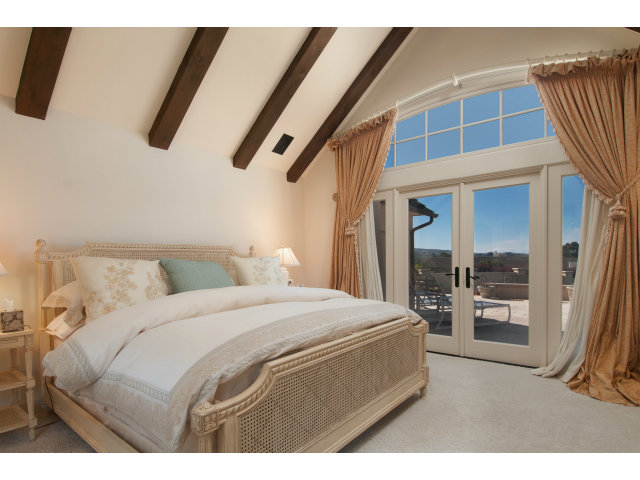 26156 Ladera Drive Carmel, CA 93923 - Photo 9 of 22 a bedroom with a bed and walk in closet