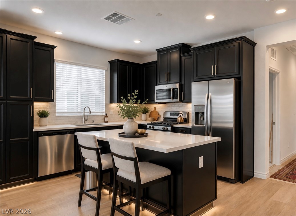 7330 North Decatur Boulevard, Unit 6 North Las Vegas, NV 89084 - Photo 5 of 42 Culinary aspirations find their home in this well-appointed kitchen, boasting an inviting island.