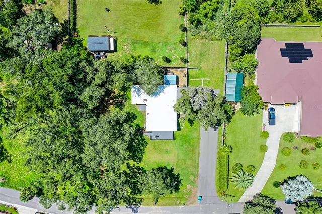 an aerial view of a house with a garden