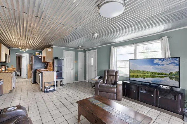 a room with furniture and a flat screen tv