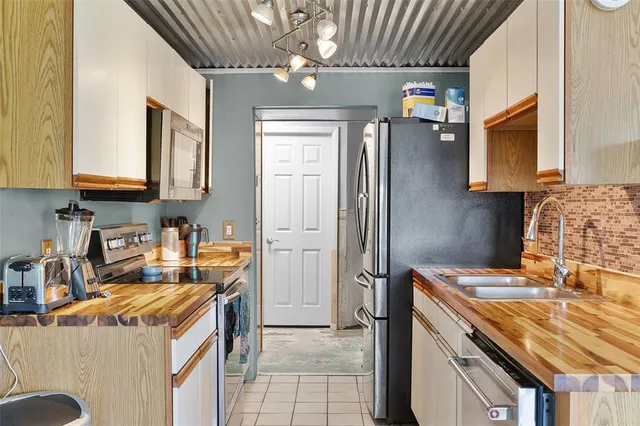 a kitchen that has a cabinets and a stove