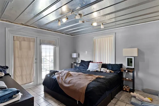 a bedroom with bed and a window