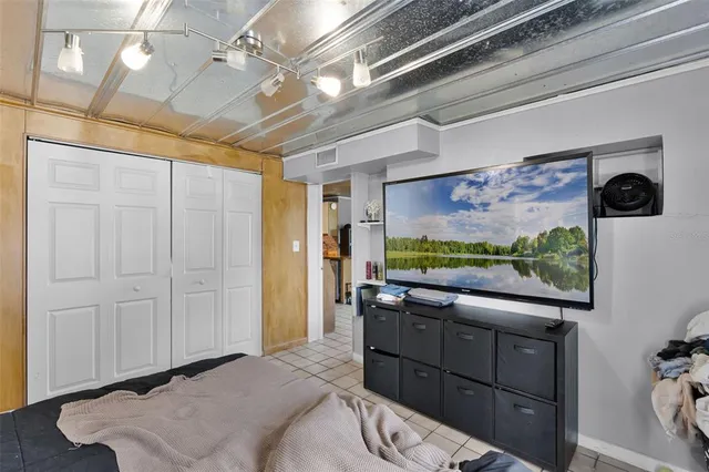 a room with furniture and a flat screen tv