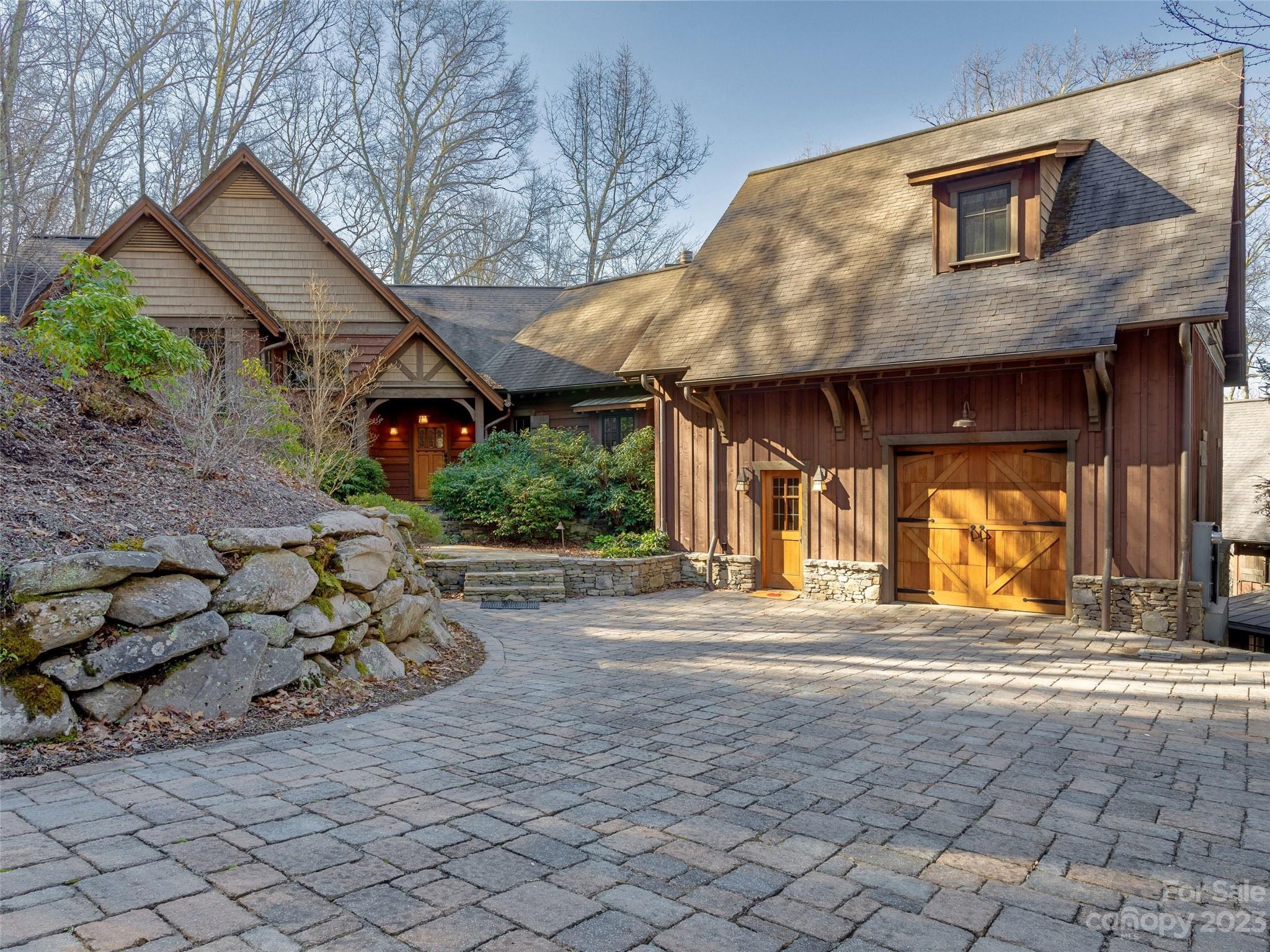 100 Boar Ridge Road Sylva, NC 28779 - Photo 2 of 48 a view of a house with backyard and sitting area