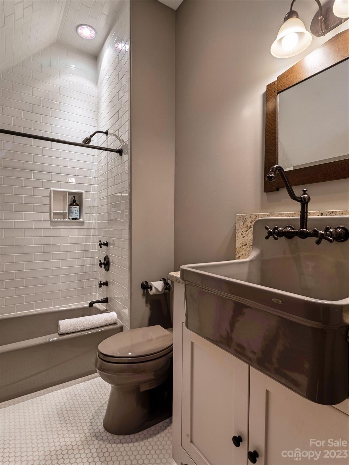 100 Boar Ridge Road Sylva, NC 28779 - Photo 27 of 48 a bathroom with a toilet a sink and a bathtub