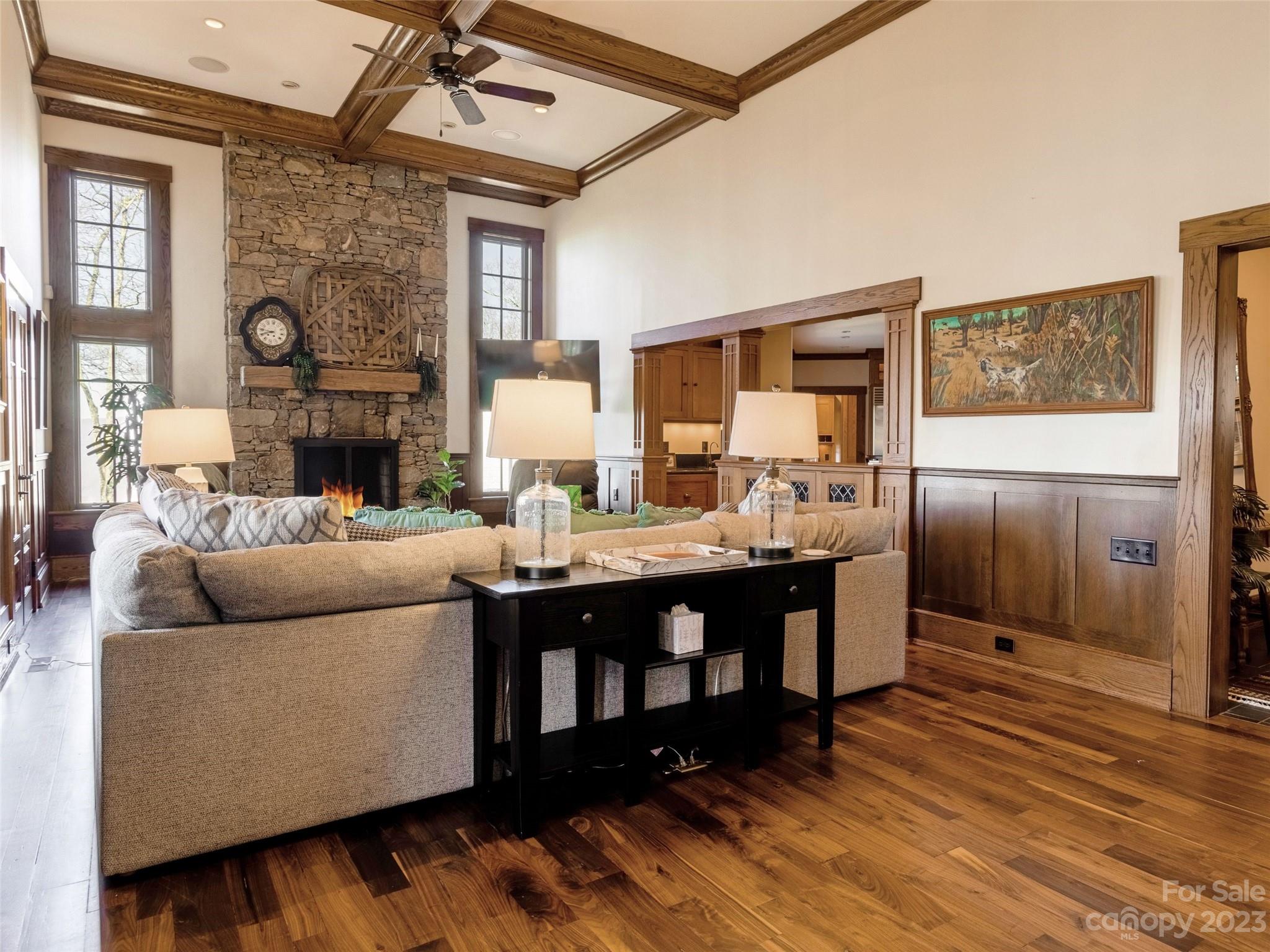 100 Boar Ridge Road Sylva, NC 28779 - Photo 4 of 48 a living room with furniture and a fireplace