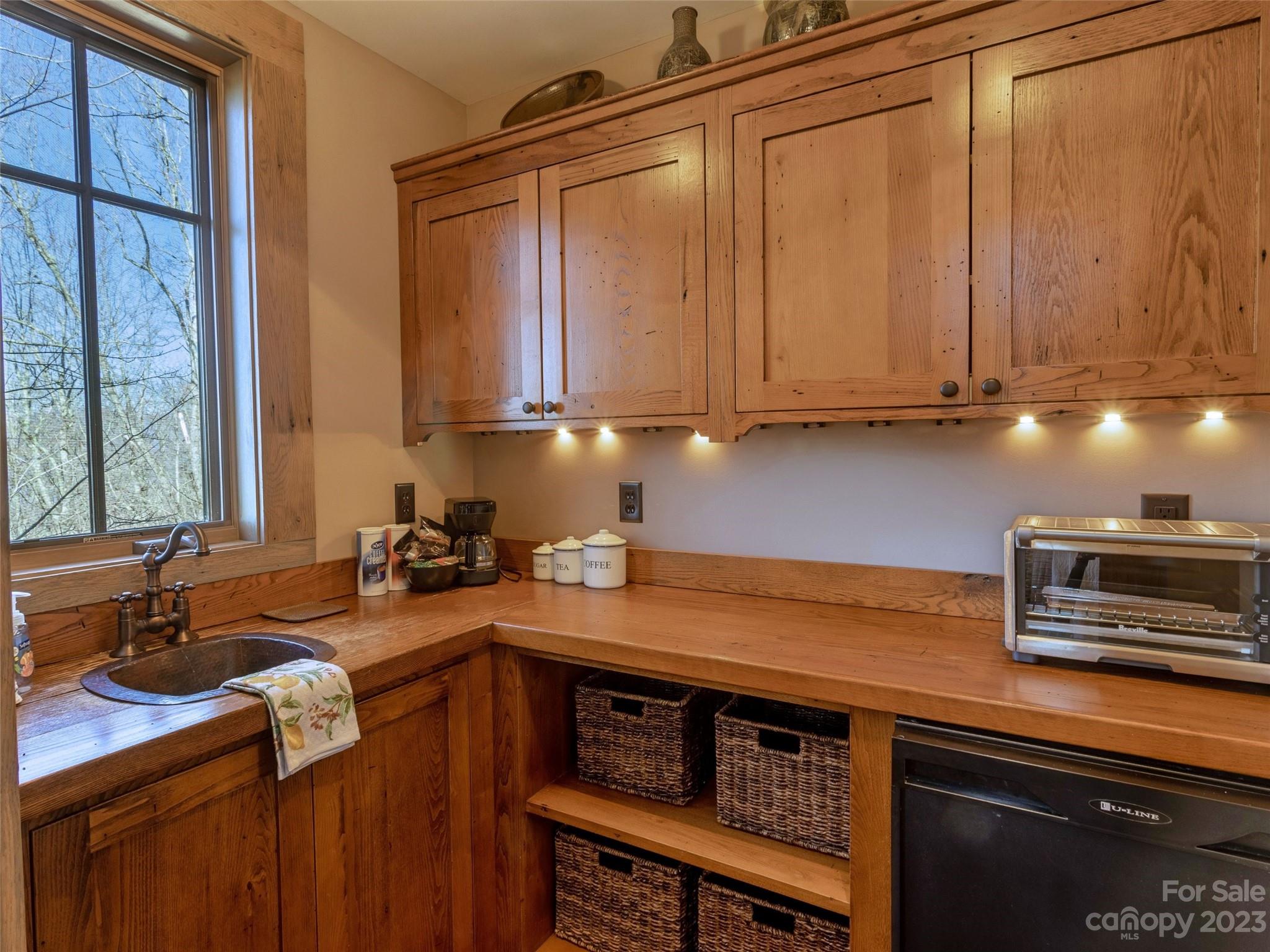 100 Boar Ridge Road Sylva, NC 28779 - Photo 42 of 48 a kitchen with a sink cabinets and appliances