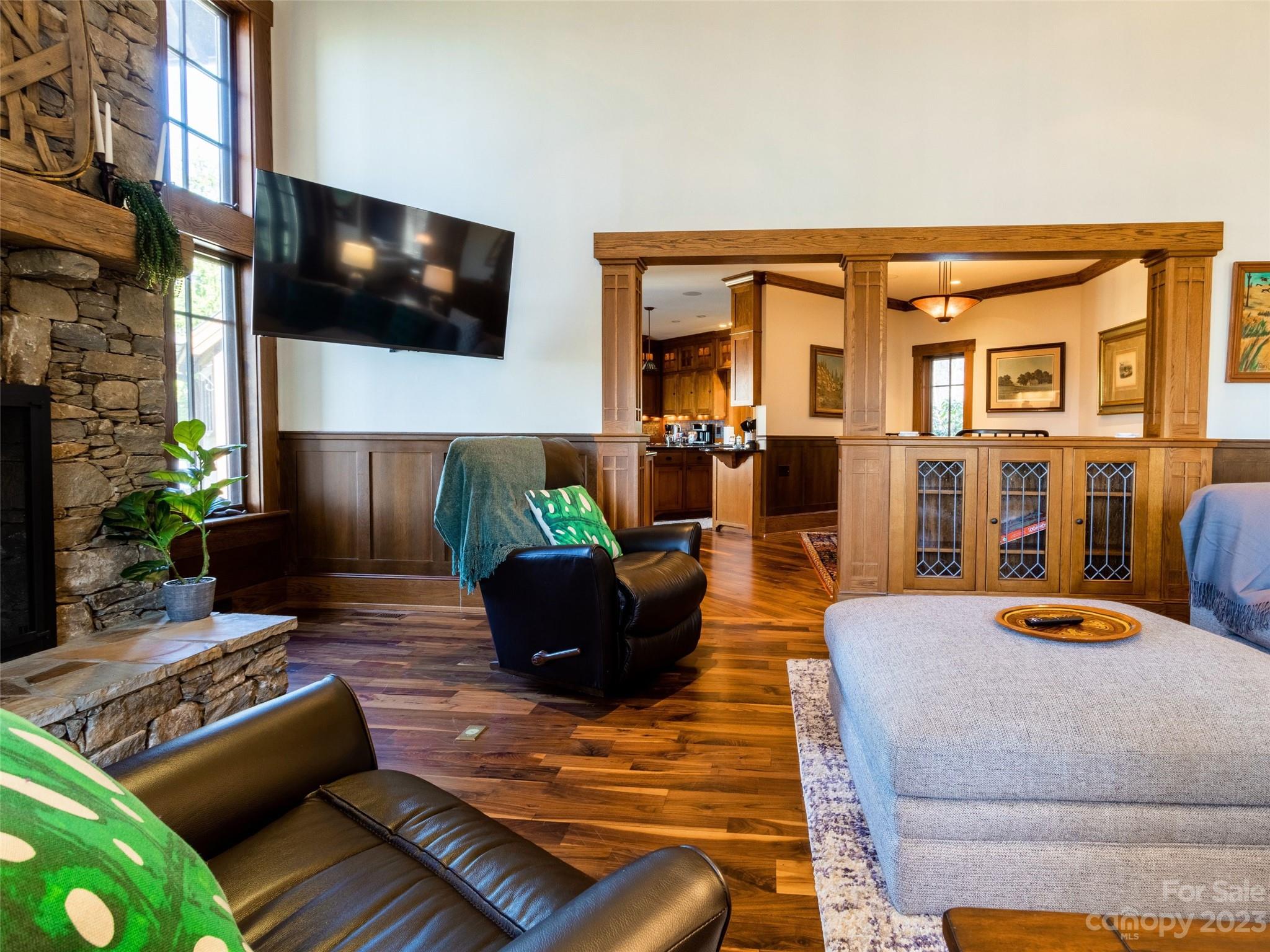 100 Boar Ridge Road Sylva, NC 28779 - Photo 6 of 48 a living room with fireplace furniture and a flat screen tv