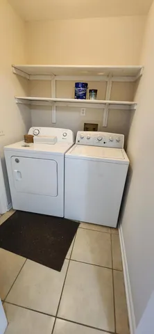 a utility room with washer and dryer