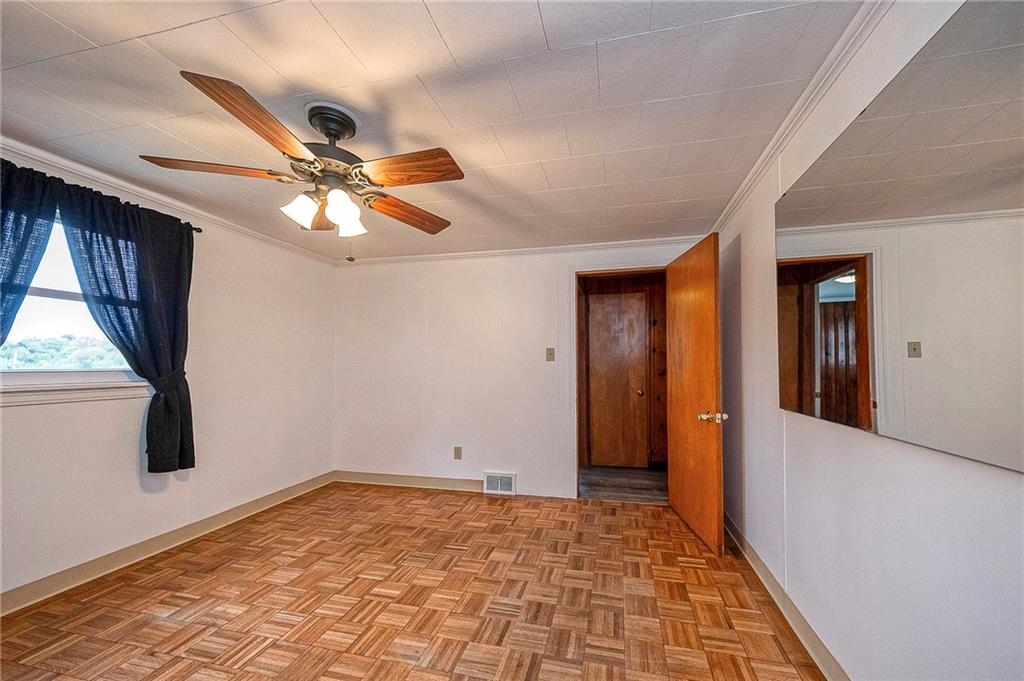531 Laughlin Avenue Pittsburgh, PA 15210 - Photo 18 of 35 a view of a hallway with a chandelier fan and windows