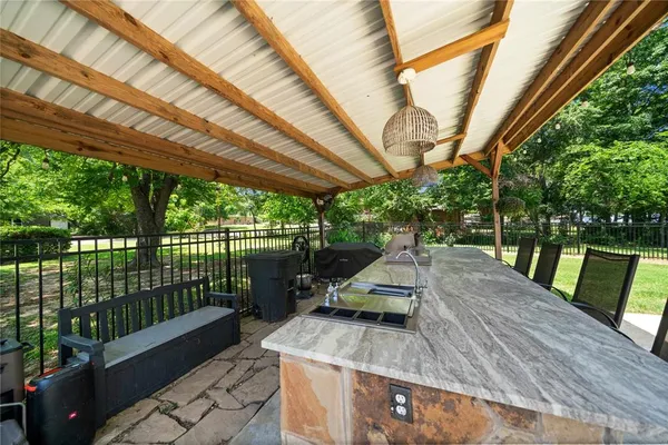 a view of swimming pool with a patio