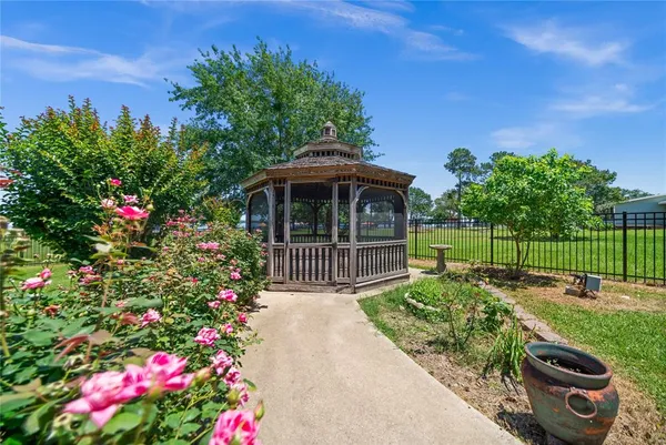 a view of a patio with a table and chairs