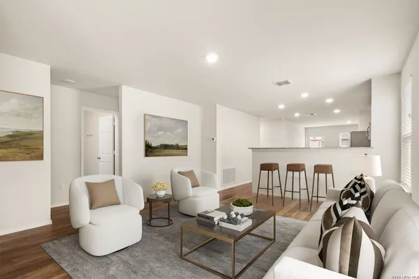 a living room with furniture and a table