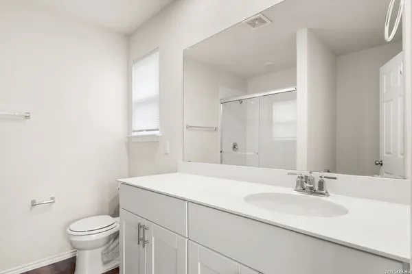 a bathroom with a sink and a toilet