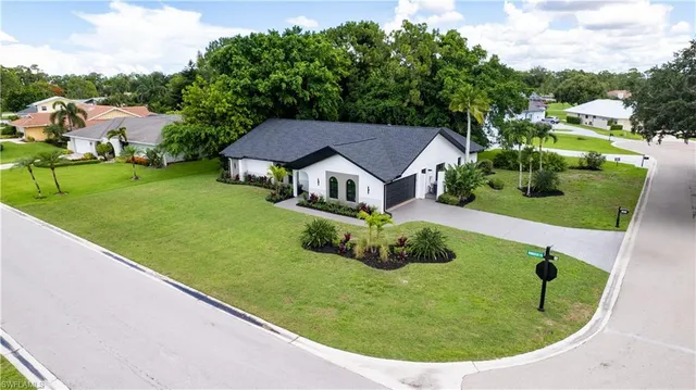 a view of a house with a backyard porch and sitting area