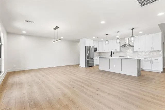 a view of kitchen with wooden floor