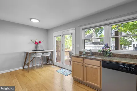 a kitchen with a sink and wooden cabinets