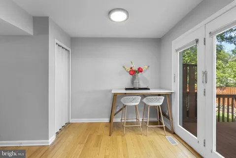 a dining room with a table and chairs
