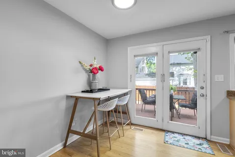 a view of a dining room with furniture wooden floor and a carpet