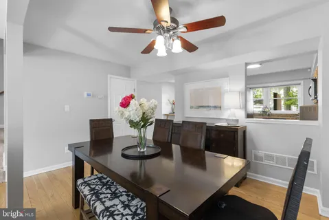 a view of a dining room with furniture and a chandelier