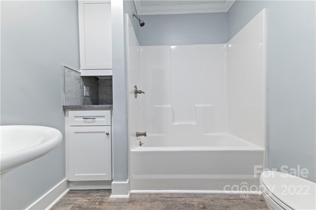 1248 West Shore Drive Lancaster, SC 29720 - Photo 11 of 27 a bathroom with a bathtub and a sink