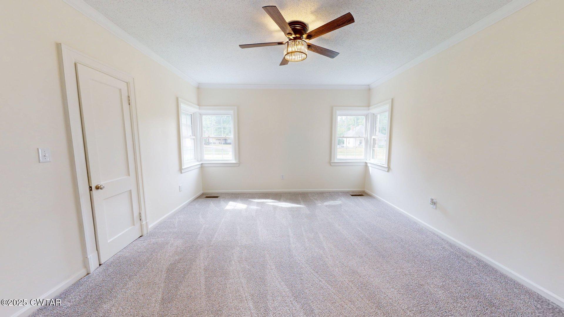 404 West Main Street Newbern, TN 38059 - Photo 13 of 35 wooden floor in an empty room with a window