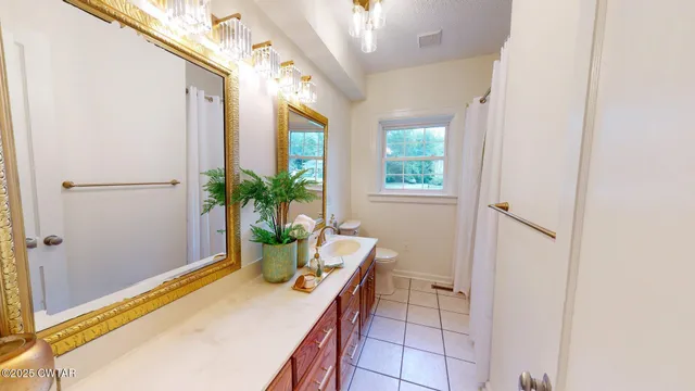 a room with window and potted plants
